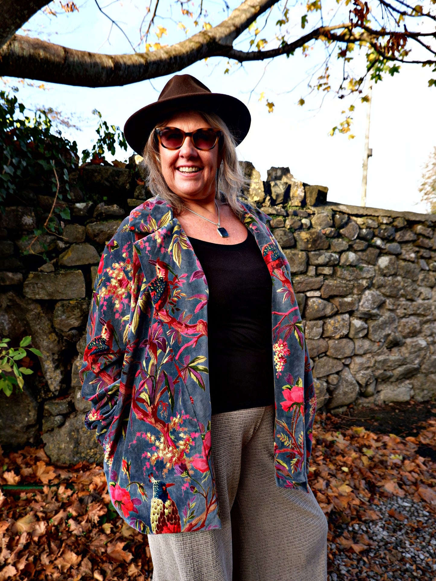woman wearing velvet jacket with bold print